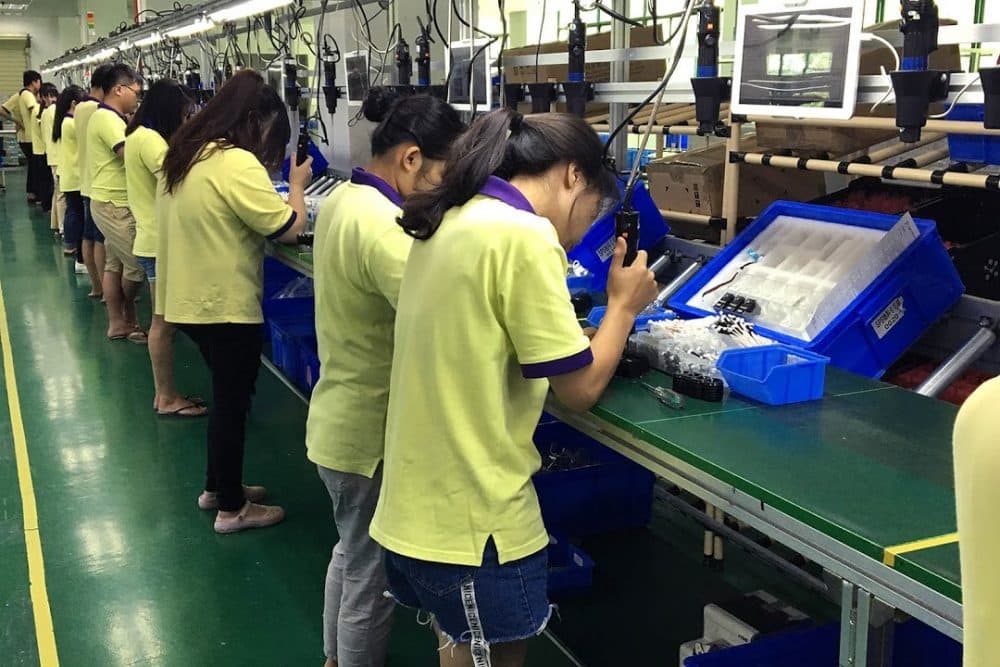 Many Chinese companies are grappling with a labor shortage and increasing wages, and are trying to automate with the help of the government. (Asma Khalid/WBUR)