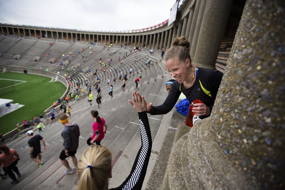 November Project participants climb stairs at Harvard Stadium in 2016. (Jesse Costa/WBUR).