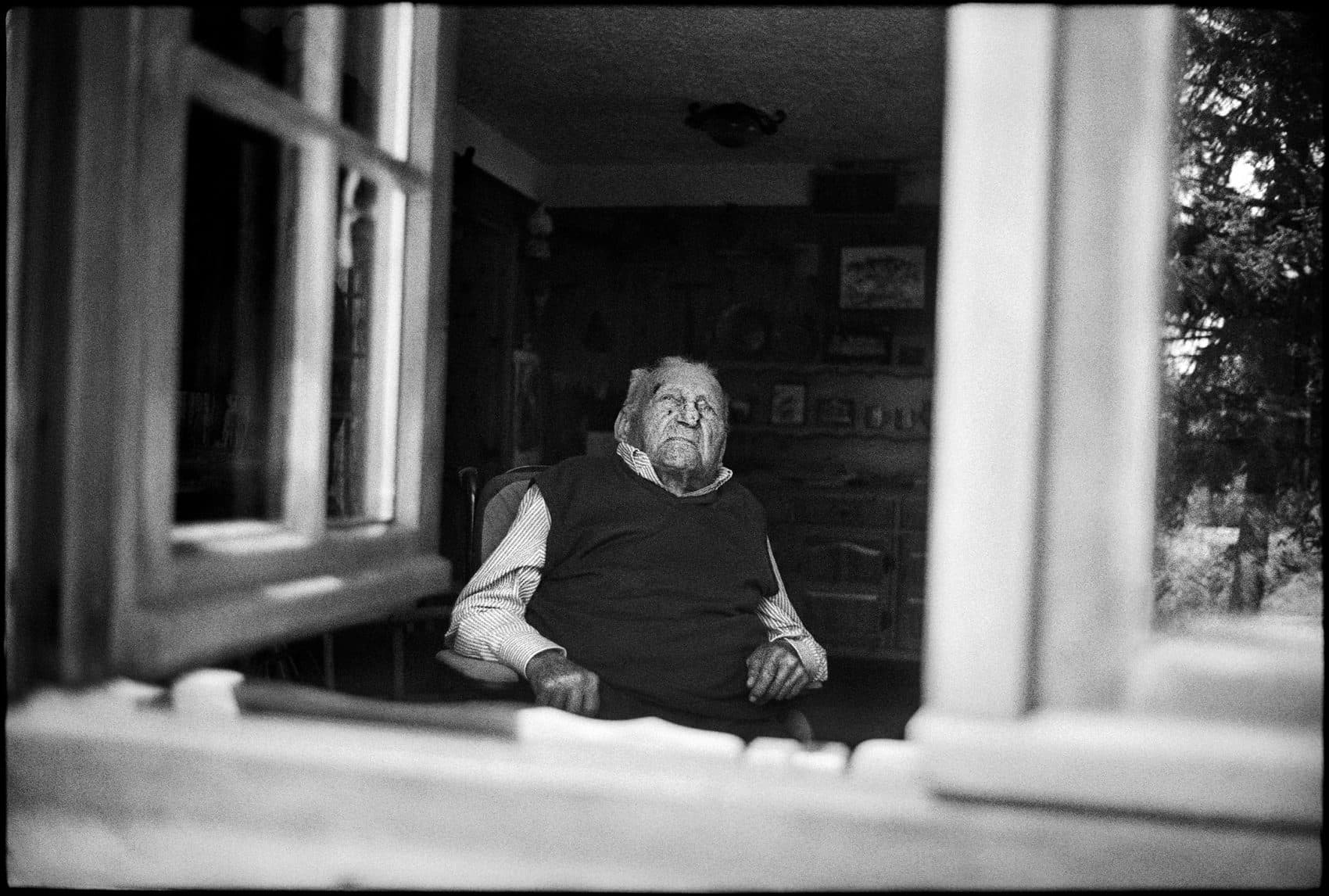 Riccardo Cassin (above) at his home in Lecco, looking out to the Italian Alps. (Courtesy Jim Herrington)