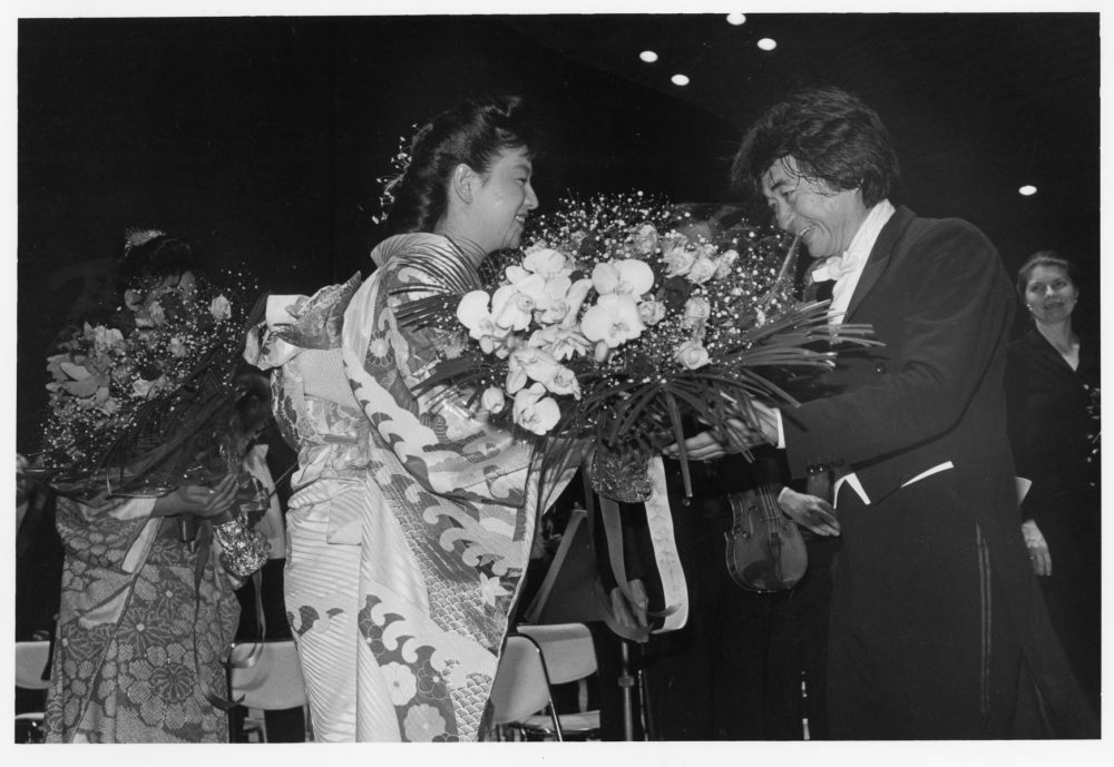Seiji Ozawa receives praise after a concert in Kobe, Japan, in 1986. (Courtesy Lincoln Russell)