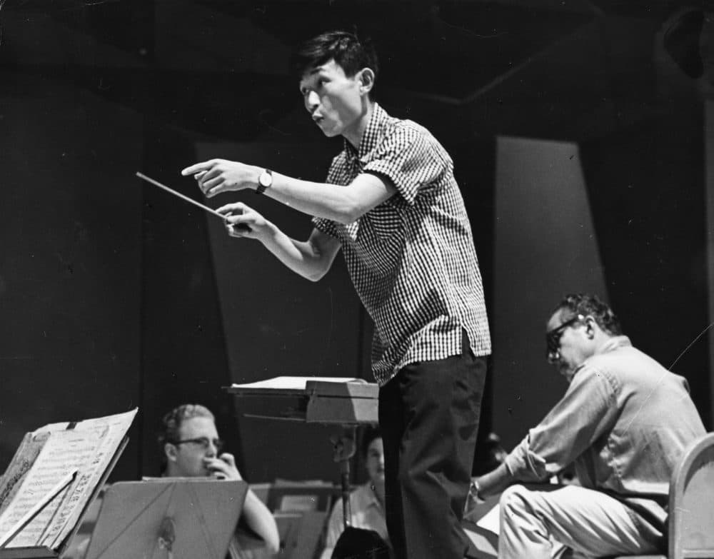 As a student in 1960, Seiji Ozawa conducts the Tanglewood Music Center orchestra in a rehearsal. (Courtesy Heinz Weissenstein/Whitestone Photo/BSO Archives)