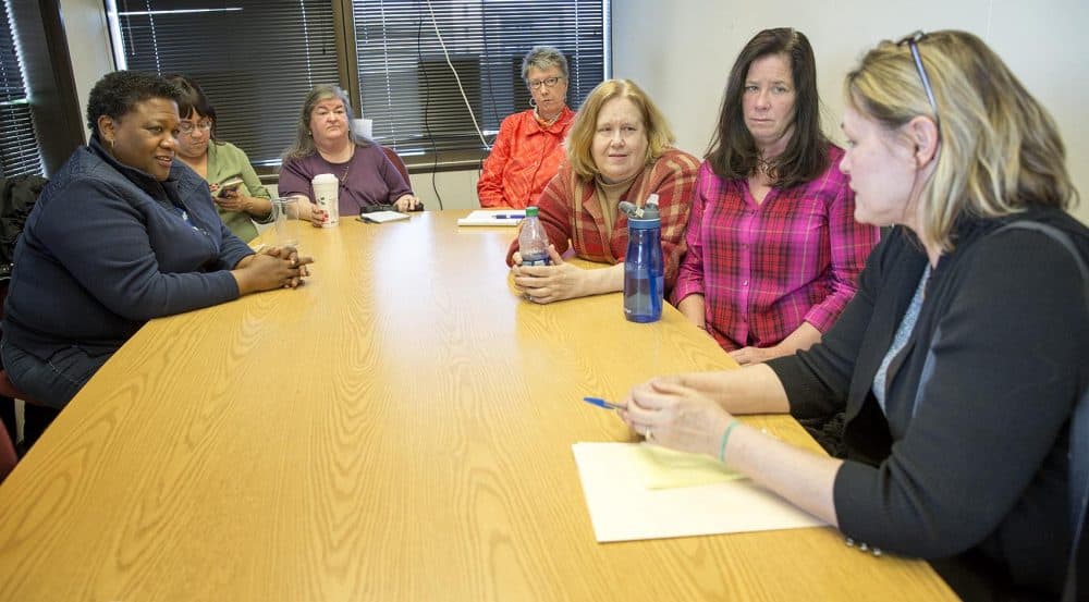 Seven women who will lose their jobs in the current round of layoffs at UMass Boston meet on campus to talk about their plans and the problems they are facing. (Robin Lubbock/WBUR)