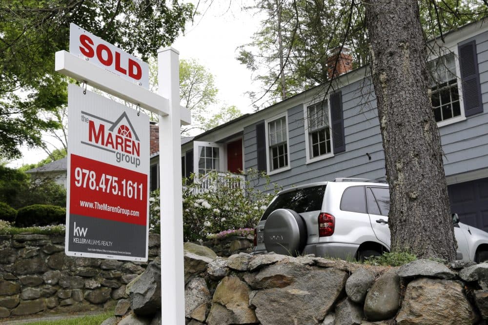 In this May 24, 2016 file photo, a "Sold" sign is placed front of a house in Andover, Mass. (Elise Amendola/AP)