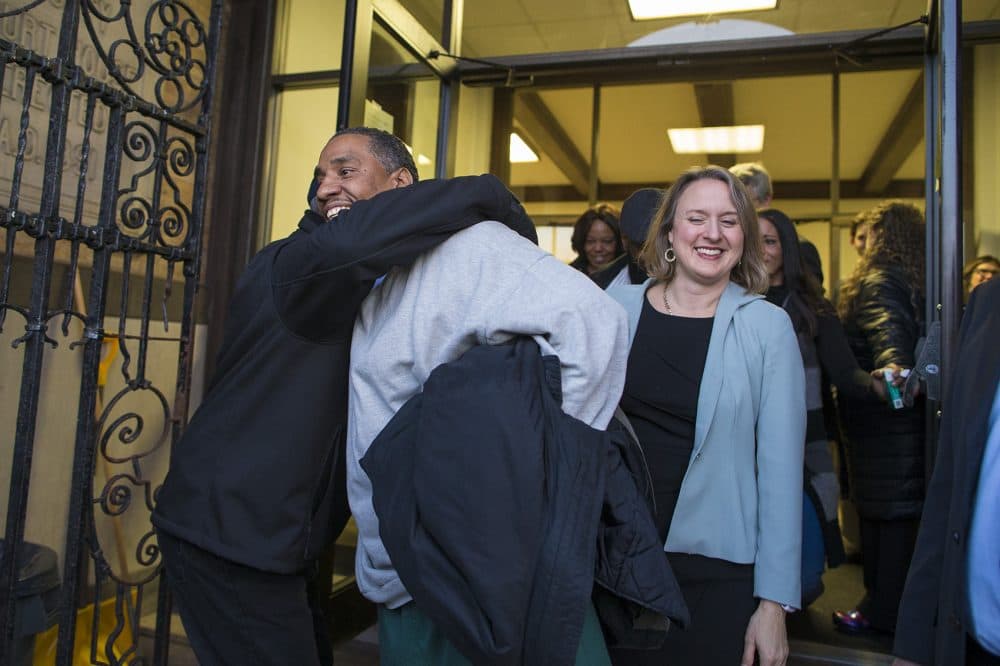 Darrell Jones walks out of the Brockton Superior Courthouse with his attorney Lisa Kavanaugh after he was released on bail after being incarcerated for 32 years for a crime he maintains he did not commit. (Jesse Costa/WBUR)