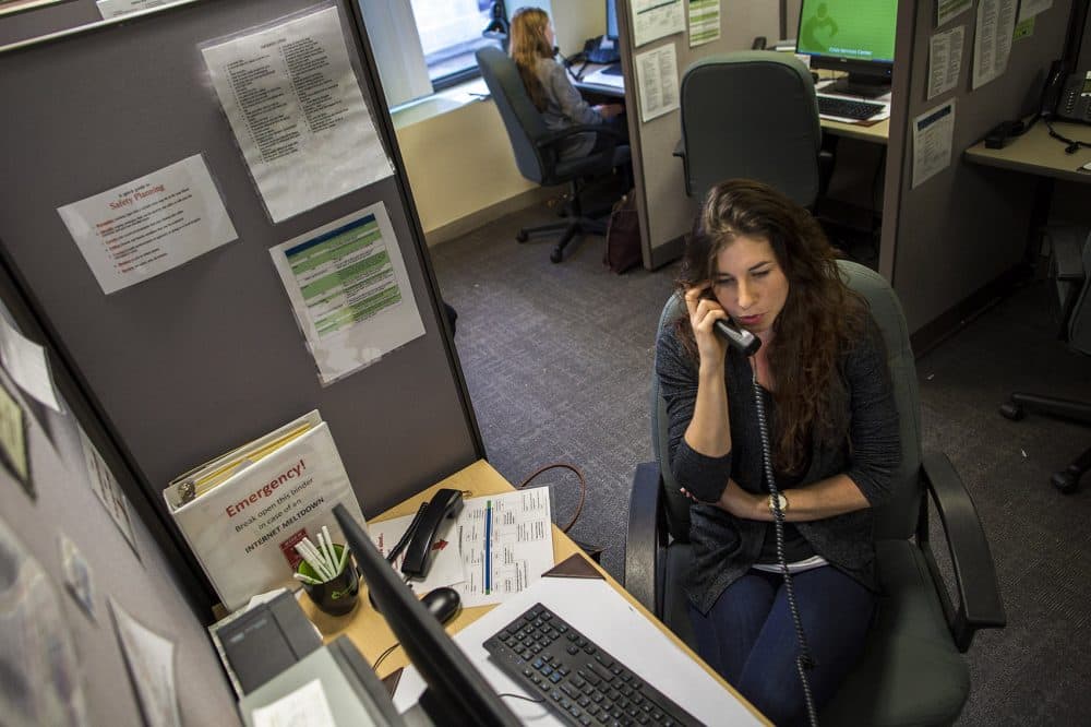 Emma speaking with a caller on the Samaritans hotline. (Jesse Costa/WBUR)