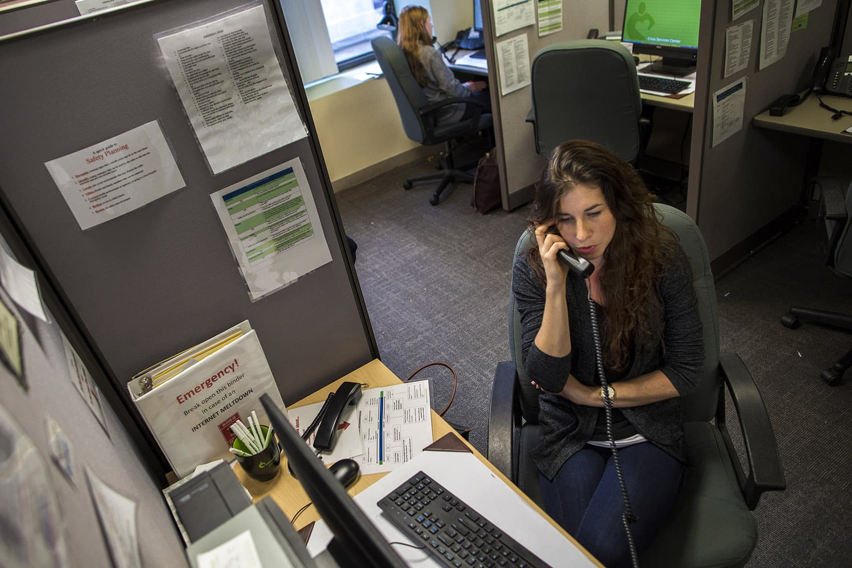 Emma speaking with a caller on the Samaritans hotline. (Jesse Costa/WBUR)