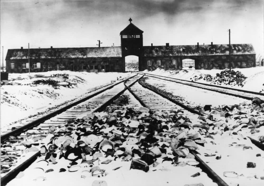 Entry to the concentration camp Auschwitz-Birkenau, Poland, with snow covered railtracks leading to the camp in February/March 1945. (Stanislaw Mucha/AP)