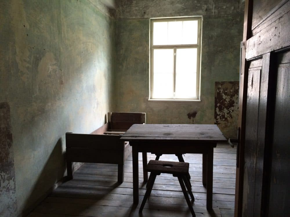A room in one of the blocks of the former Auschwitz I camp site, 2015. (Courtesy Andrea Pitzer)