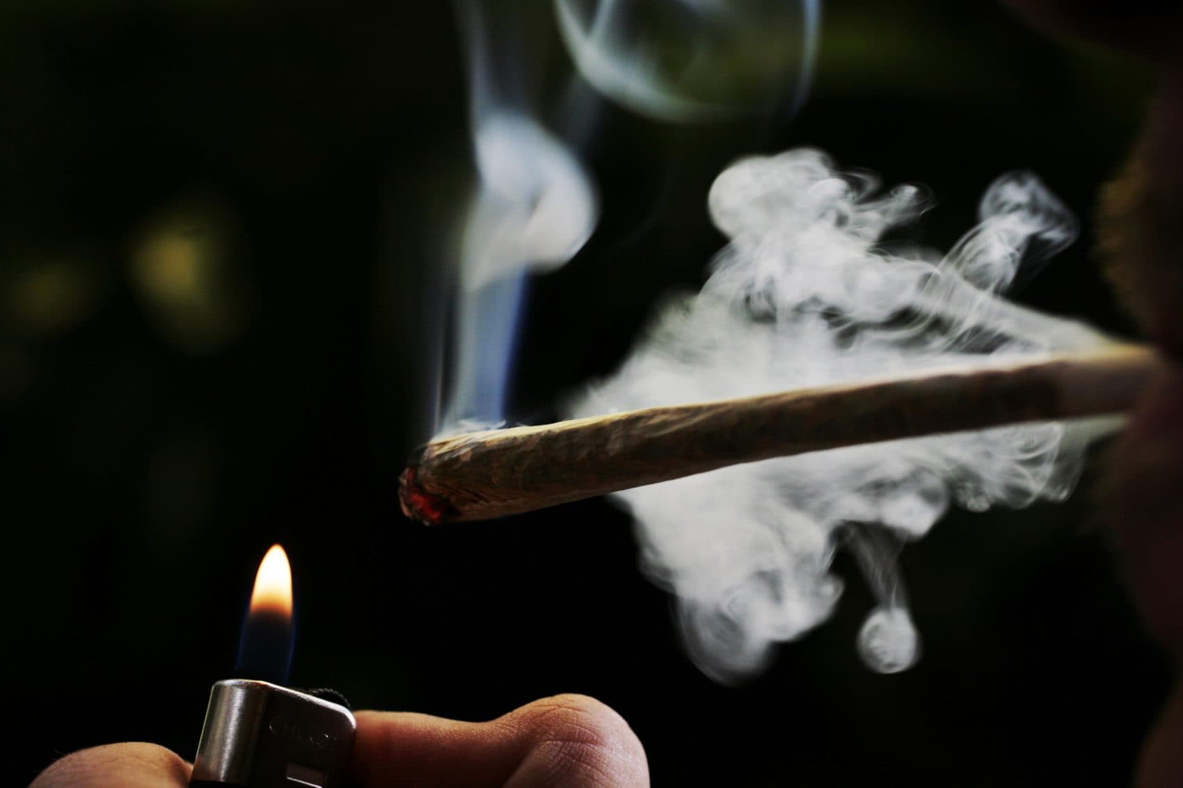 In this 2008 file photo, a person demonstrates how to smoke a marijuana joint in a coffee shop in Amsterdam, Netherlands. (Peter Dejong/AP)