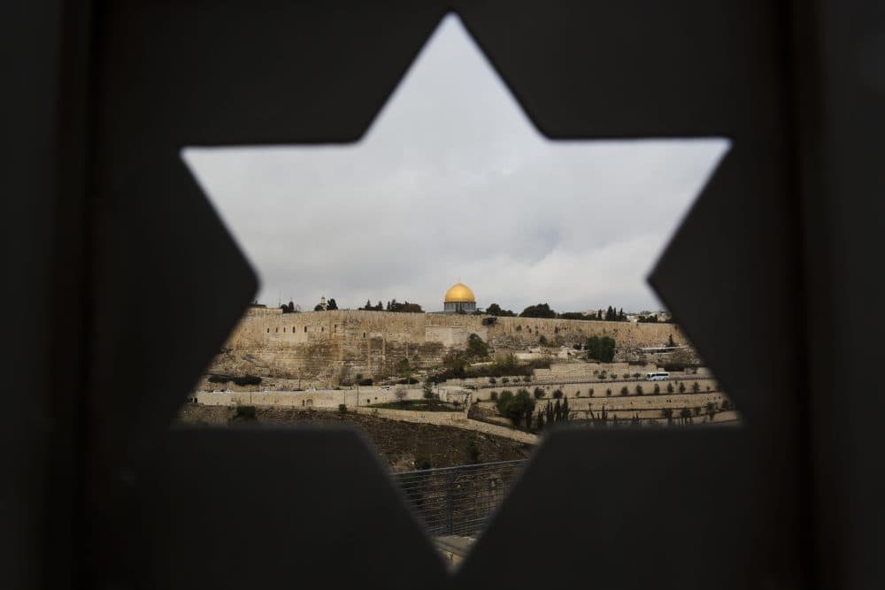 Jerusalem Old City is seen trough a door with the shape of star of David, in Jerusalem, Wednesday, Dec. 6, 2017. (Oded Balilty/AP)