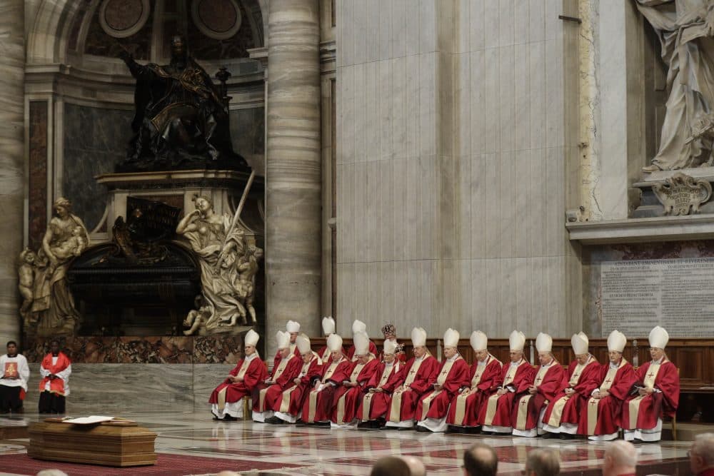 A moment of the funeral service for late Cardinal Bernard Law, at St. Peter's basilica at the Vatican, Thursday, Dec. 21, 2017. Law, who died Wednesday at age 86, resigned in disgrace as archbishop of Boston in 2002 after revelations that he covered up for dozens of priests who raped and sexually molested children, moving them to different parishes without telling parents or police. (Gregorio Borgia/AP)