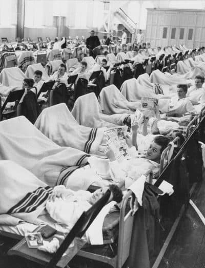 Danish naval personnel suffering from Asian flu occupy beds in temporary sick quarters set up in a gym in Copenhagen's navy shipyard to handle the large number of patients, Oct. 12, 1957. Reports indicated that between 15 and 25 percent of the men were down with the flu. (AP)