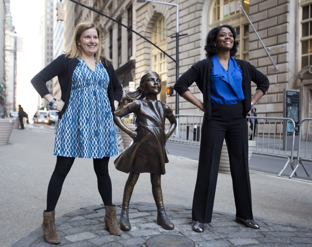 Two women pose with the &quot;Fearless Girl &quot;statue on Wall Street in New York last March. (Mark Lennihan/AP)