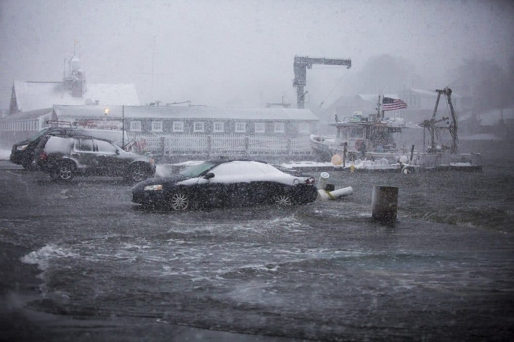 At high tide, ocean water floods T Wharf in Rockport. (Jesse Costa/WBUR)