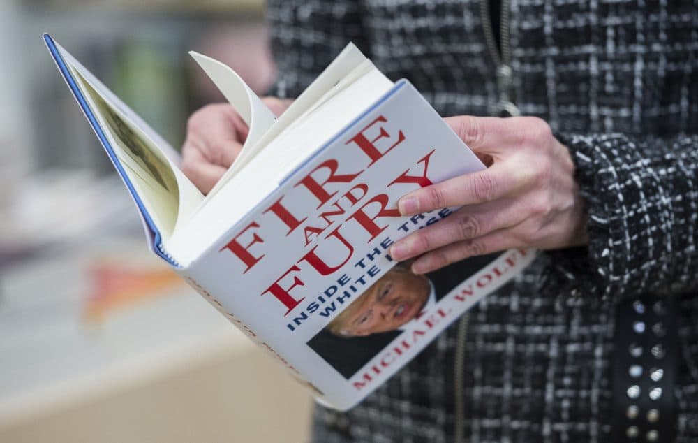 A man holds a copy of the book &quot;Fire and Fury: Inside the Trump White House&quot; by Michael Wolff, after buying it at a bookstore in Washington, D.C. on Jan. 5, 2018. The book was rushed into bookstores and onto e-book platforms four days ahead of schedule due to what its publisher called &quot;unprecedented demand&quot; — and after Trump's bid to block it failed. (Andrew Caballero-Reynolds/AFP/Getty Images)