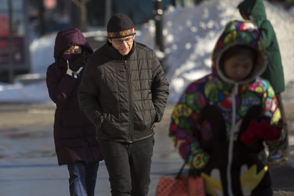Pedestrians walk in the frigid air in Kendall Square. (Jesse Costa/WBUR)