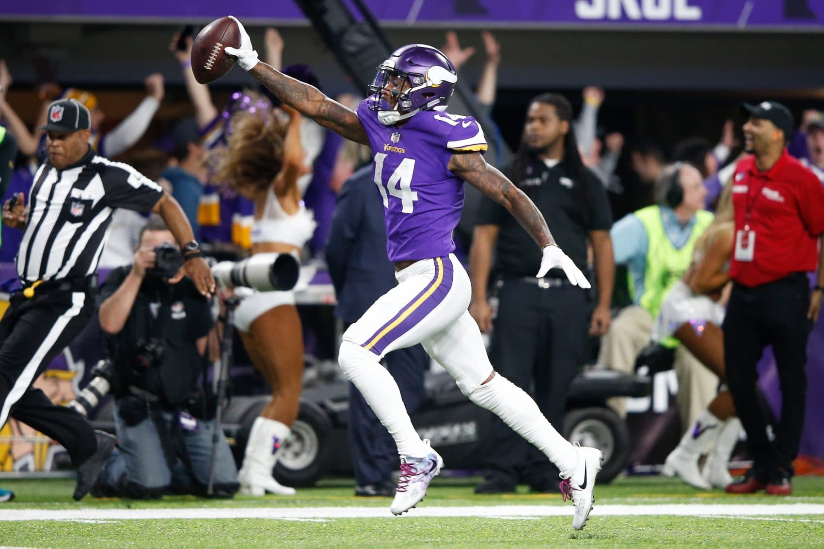 Stefon Diggs of the Vikings scores a touchdown as time expires against the New Orleans Saints in the NFC Divisional Playoff game on Sunday. (Jamie Squire/Getty Images)