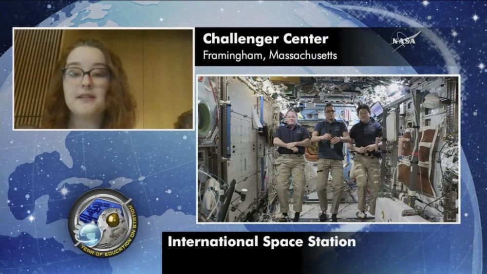 Astronauts Scott Tingle, Joe Acaba, Norishige Kanai, aboard the International Space Station, take questions from students at Framingham State University on Friday. (NASA via AP)