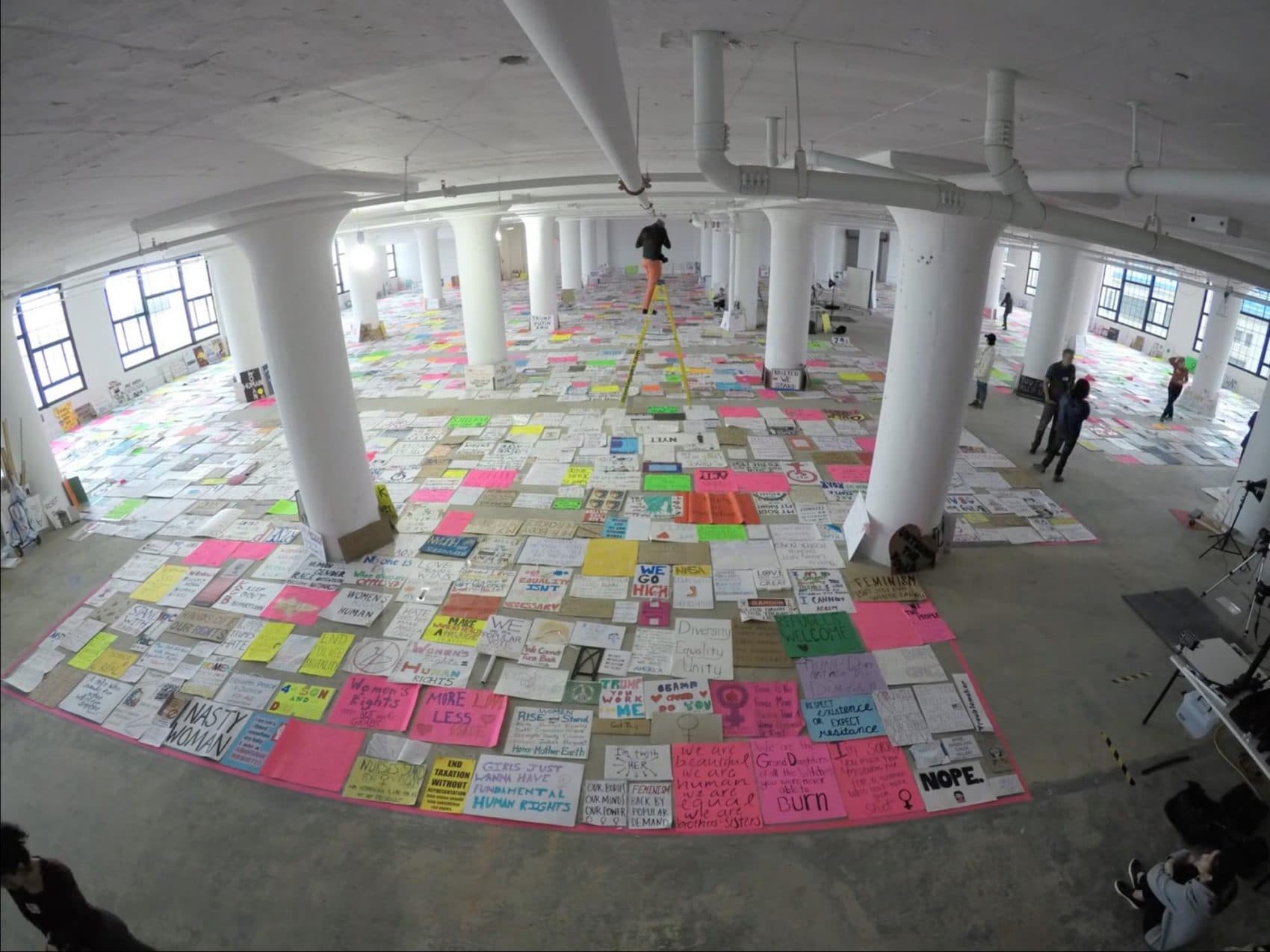 The team photographs all the posters they collected from the Women's March in Boston. (Courtesy Dietmar Offenhuber/Art of the March)