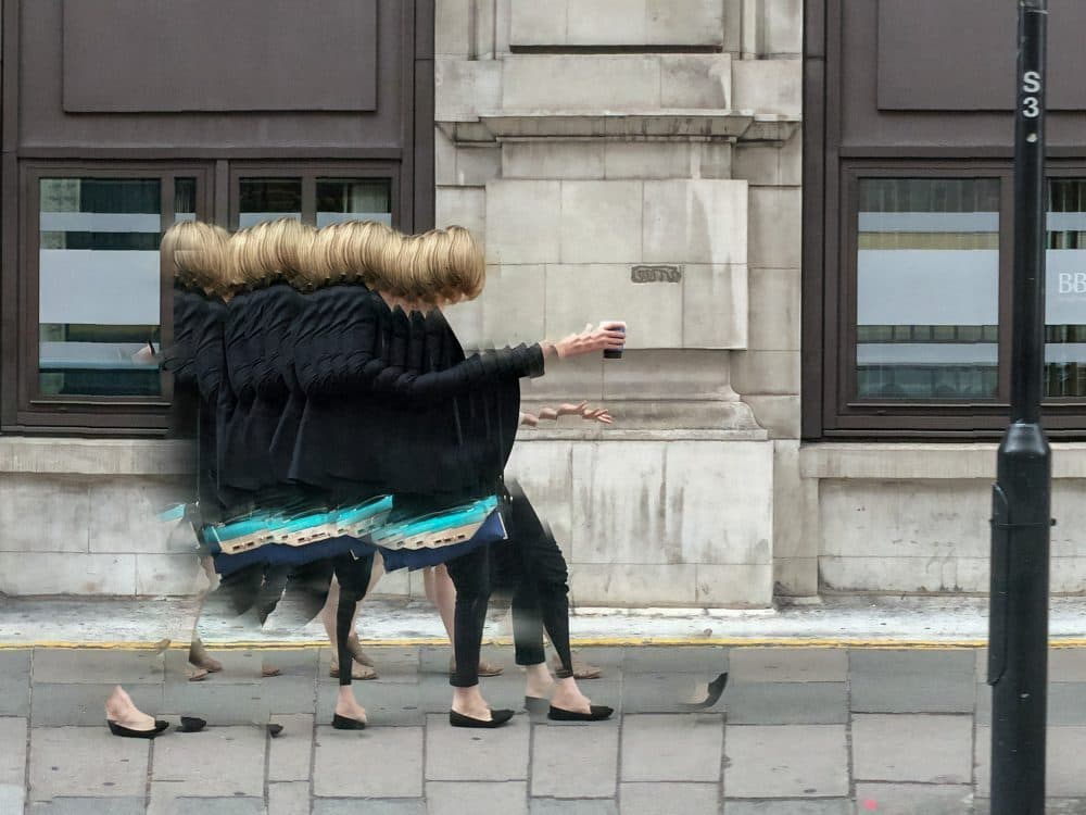 A woman tries to catch her cellphone in London in 2015. (Courtesy Rosamond and Dennis Purcell)
