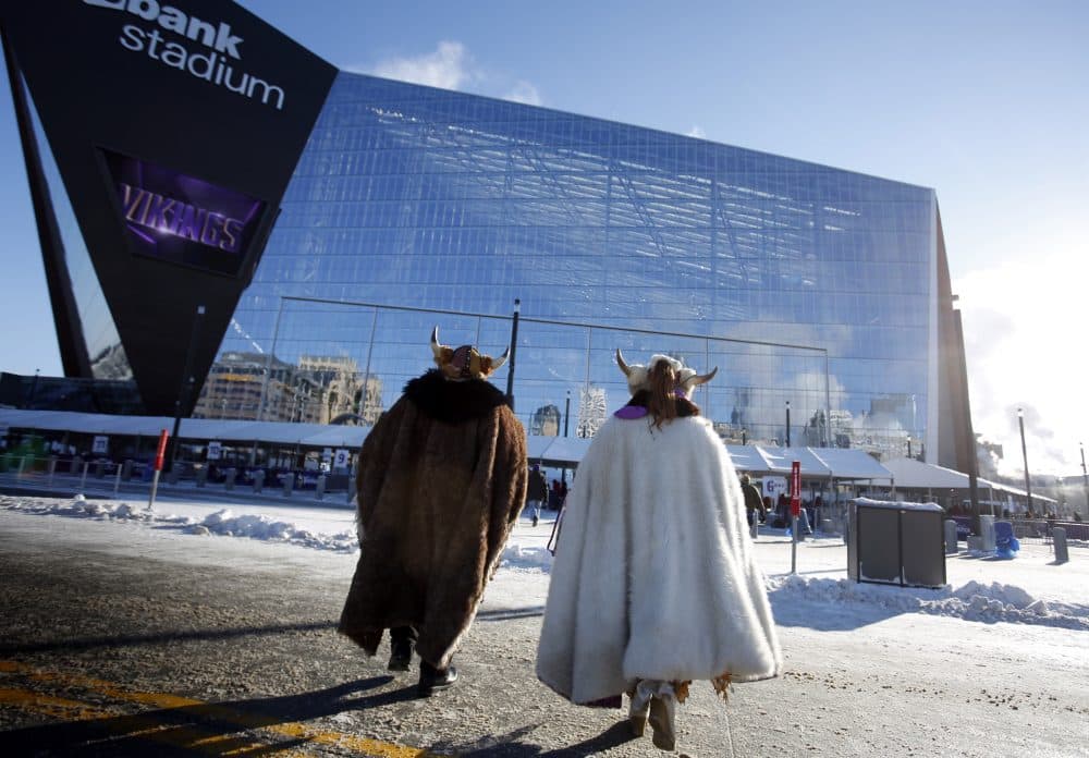 Fans bundled up for the cold weather head for U.S. Bank Stadium before the start of an NFL football game between the Indianapolis Colts and the Minnesota Vikings Sunday, Dec. 18, 2016, in Minneapolis. (Andy Clayton-King/AP)