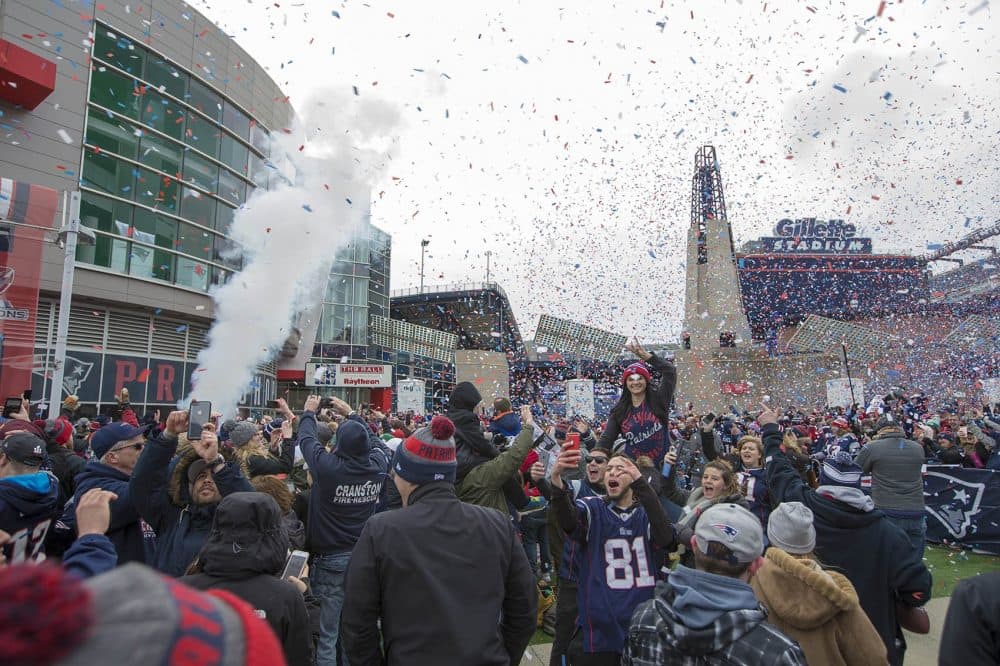 Confetti falls around Patriot Place at the conclusion of the rally. (Jesse Costa/WBUR)