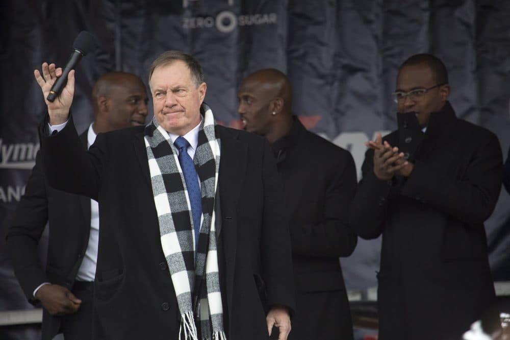 Patriots coach Bill Belichick waves to the crowd during the sendoff rally. (Jesse Costa/WBUR)