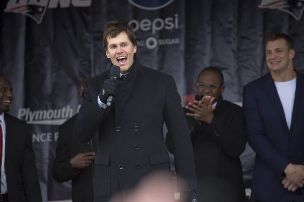Patriots quarterback Tom Brady speaks to the crowd. (Jesse Costa/WBUR)