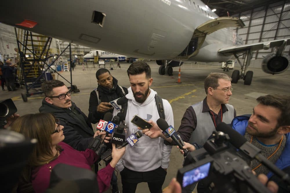 Pitcher Rick Porcello speaks to the media at Logan Airport prior to the disaster relief trip to Puerto Rico. (Jesse Costa/WBUR)