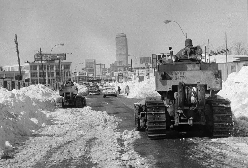 Two members of the U.S. Army 27th Engineers from Fort Bragg, N.C. move their bulldozers slowly toward downtown Boston as the city began to remove the record snowfall from the streets, seen in this Feb. 11, 1978 file photo. (AP)