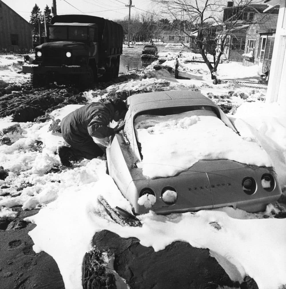 A National Guardsman checks a stranded car Feb. 9, 1978, in Hampton, N.H., after the Blizzard of '78 to see if anyone was trapped inside. (Tim Savard/AP)