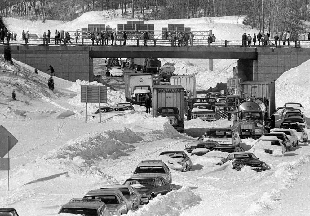 Cars and trucks stranded and abandoned in deep snow along Route 128 in Dedham, Mass., are seen in this Feb. 9, 1978 as military and civilian plows begin to dig them out during the blizzard of 1978. (AP)