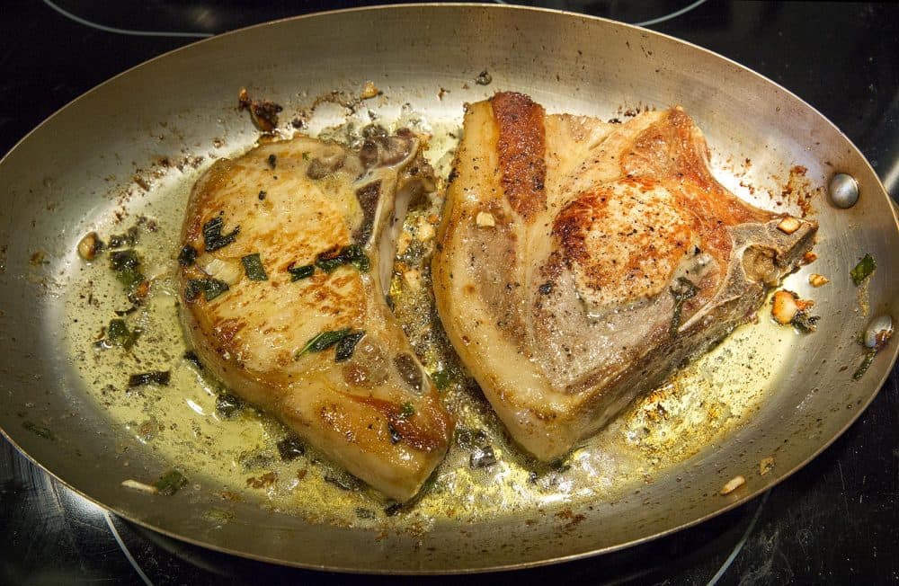 Chef Kathy Gunst's pan roasted pork chops with garlic-sage butter. (Robin Lubbock/WBUR)