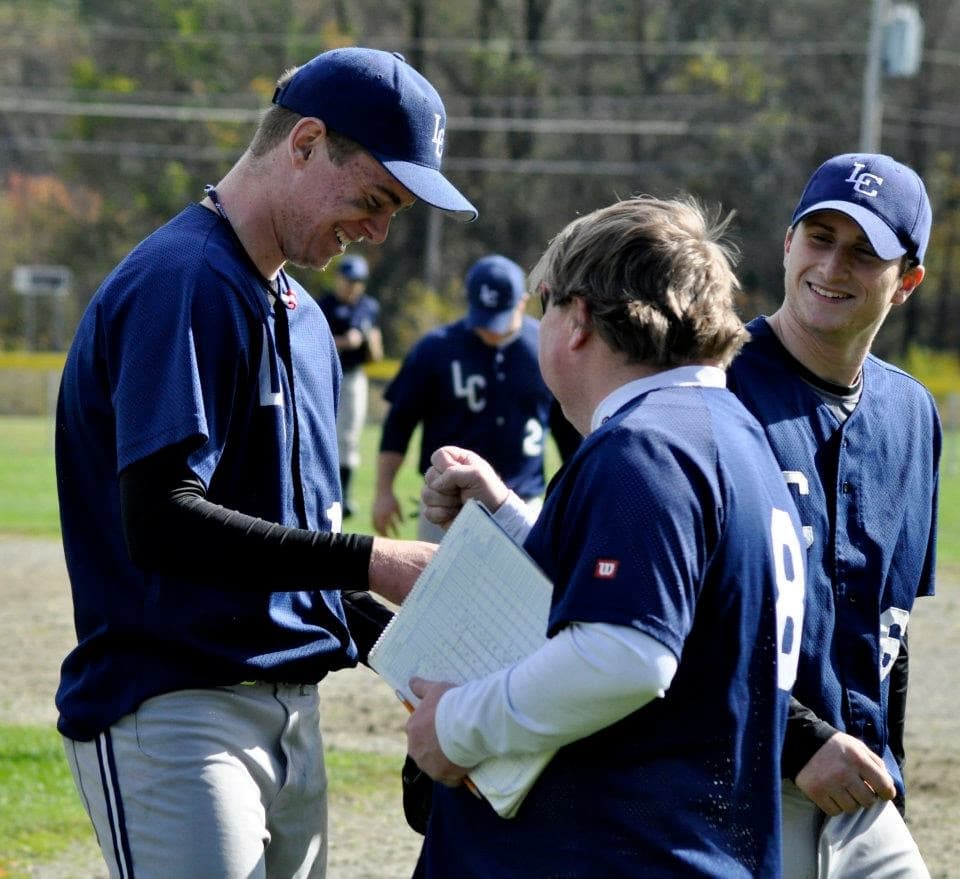Pat (left), coach John Wood (center) and third baseman Chris Hawkins during a meeting on the mound. (Courtesy Landmark College)