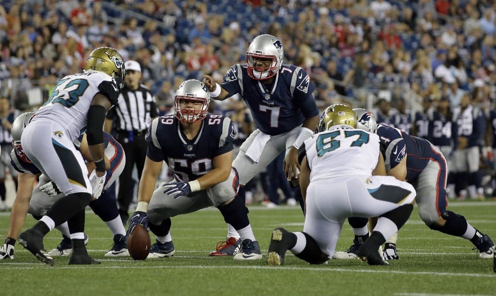 Patriots quarterback Jacoby Brissett calls signals behind center James Ferentz (59) in a preseason game against the Jacksonville Jaguars, on Aug. 10, 2017. (Steven Senne/AP)