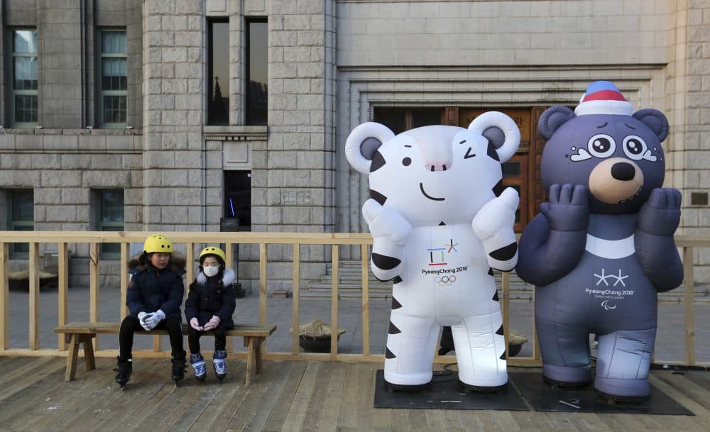 Children sit next to the 2018 Pyeongchang Winter Olympic Games' official mascots, near Seoul Plaza Ice Rink in Seoul, South Korea, Tuesday, Jan. 2, 2018. South Korea on Tuesday offered high-level talks with rival North Korea to find ways to cooperate on next month's Winter Olympics in the South. (Ahn Young-joon/AP)