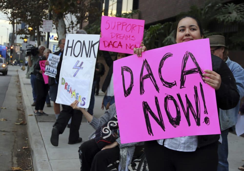 Demonstrators urging the Democratic Party to protect DACA rally outside the office of Sen. Dianne Feinstein in Los Angeles Wednesday, Jan. 3, 2018. (Reed Saxon/AP)