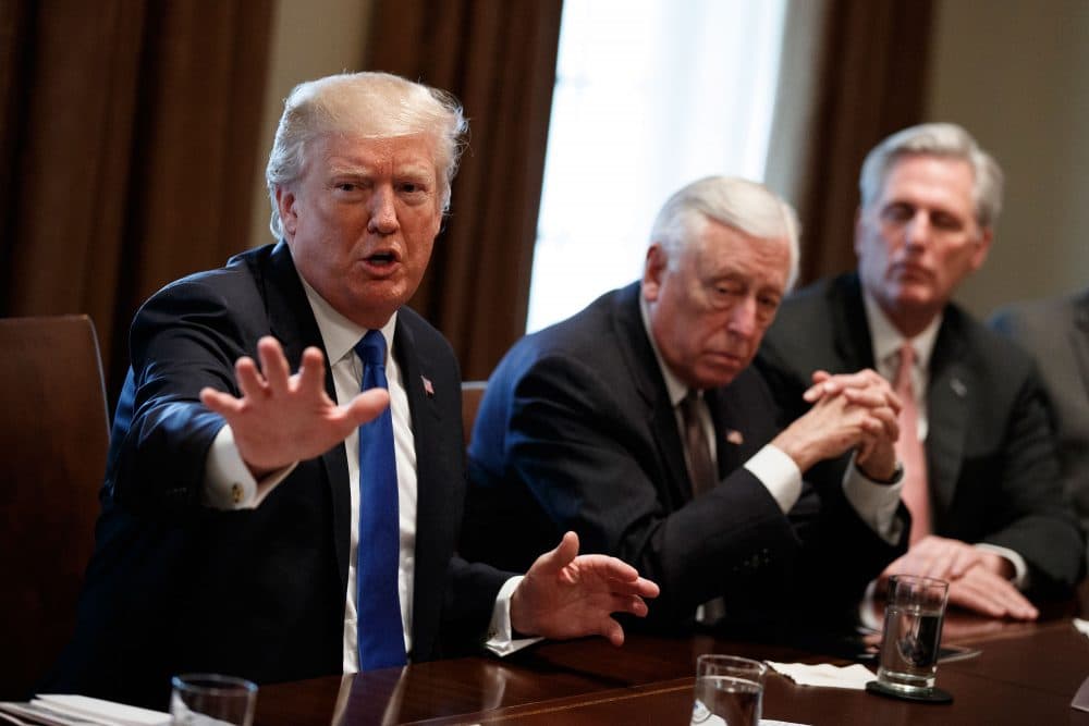 President Trump, seen here during a meeting with lawmakers on immigration policy, is viewed favorably by just 29 percent of Massachusetts voters. (Evan Vucci/AP)