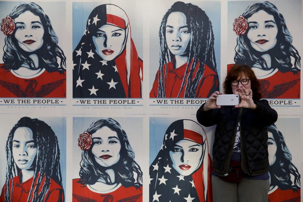 A protester takes a selfie in front of posters supporting women's rights during a Women's March, Saturday, Jan. 20, 2018, in Los Angeles. (Jae C. Hong/AP)
