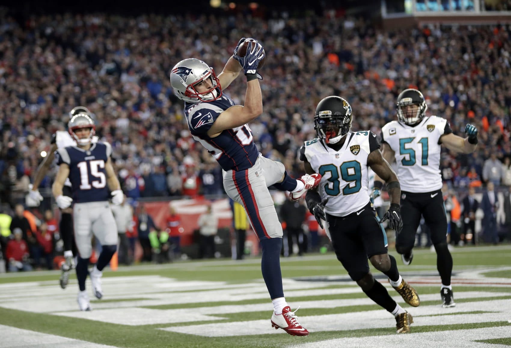 New England Patriots wide receiver Danny Amendola (80) catches a touchdown pass in front of Jacksonville Jaguars safety Tashaun Gipson (39) and linebacker Paul Posluszny (51) during the second half of the AFC championship NFL football game, Sunday, Jan. 21, 2018, in Foxborough, Mass. (AP Photo/David J. Phillip)