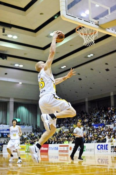 Tyler dunking during a game in Japan. (Courtesy Tyler Smith)