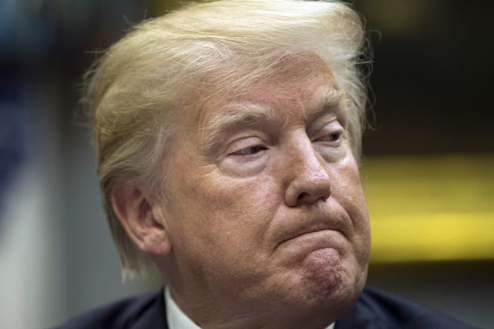 President Donald Trump pauses during a prison reform roundtable in the Roosevelt Room of the Washington, Thursday, Jan. 11, 2018. (AP Photo/Carolyn Kaster)