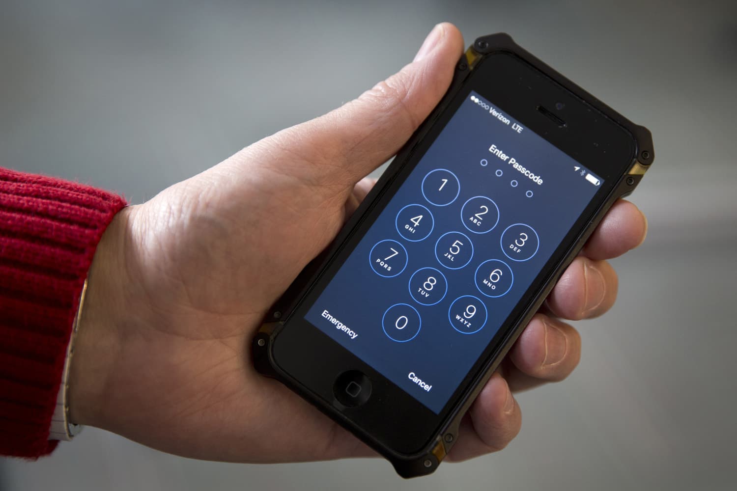 In this Feb. 17, 2016, file photo an iPhone is seen in Washington. A new lawsuit claims the governments practice of searching laptops and cellphones at airports and border crossings is unconstitutional because modern electronic devices carry troves of private information. (AP Photo/Carolyn Kaster, File)