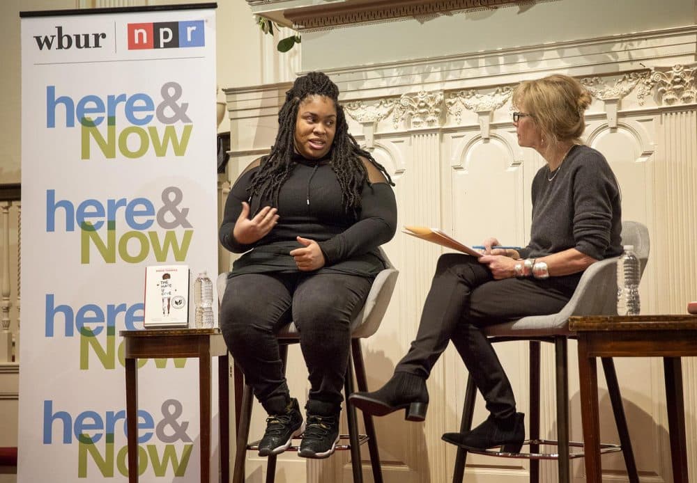 Author Angie Thomas talks with WBUR's Robin Young at the First Parish Church in Cambridge. (Robin Lubbock/WBUR)