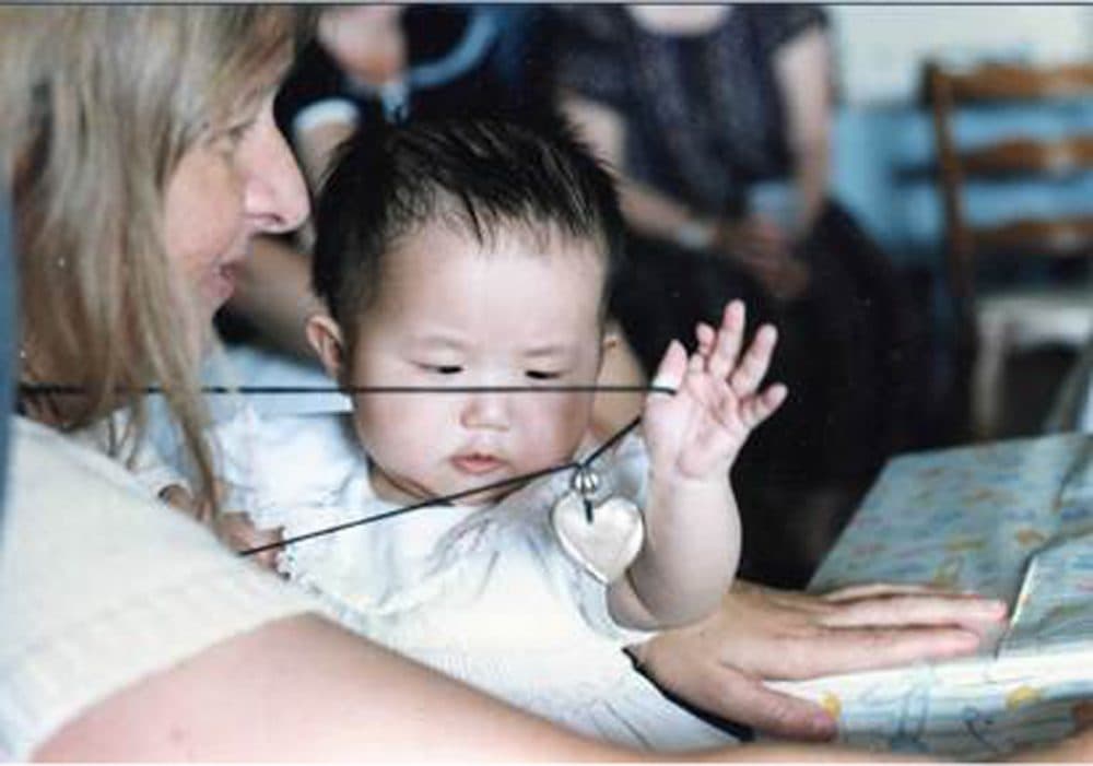 Maya Ludtke, who was adopted after being abandoned in China, at her mother's baby shower. (Courtesy Melissa Ludtke; Photo by Stan Grossfeld)