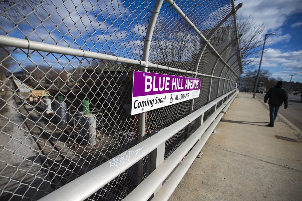 A stone's throw from the Cote development, a new stop on the commuter rail -- Blue Hill Avenue Station -- is under construction. (Jesse Costa/WBUR)