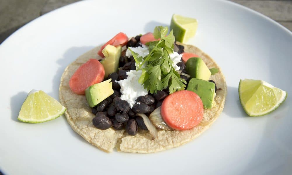 Vegetarian bean taco with sour cream, pickled radish and salsa, from chef Kathy Gunst. (Robin Lubbock/WBUR)