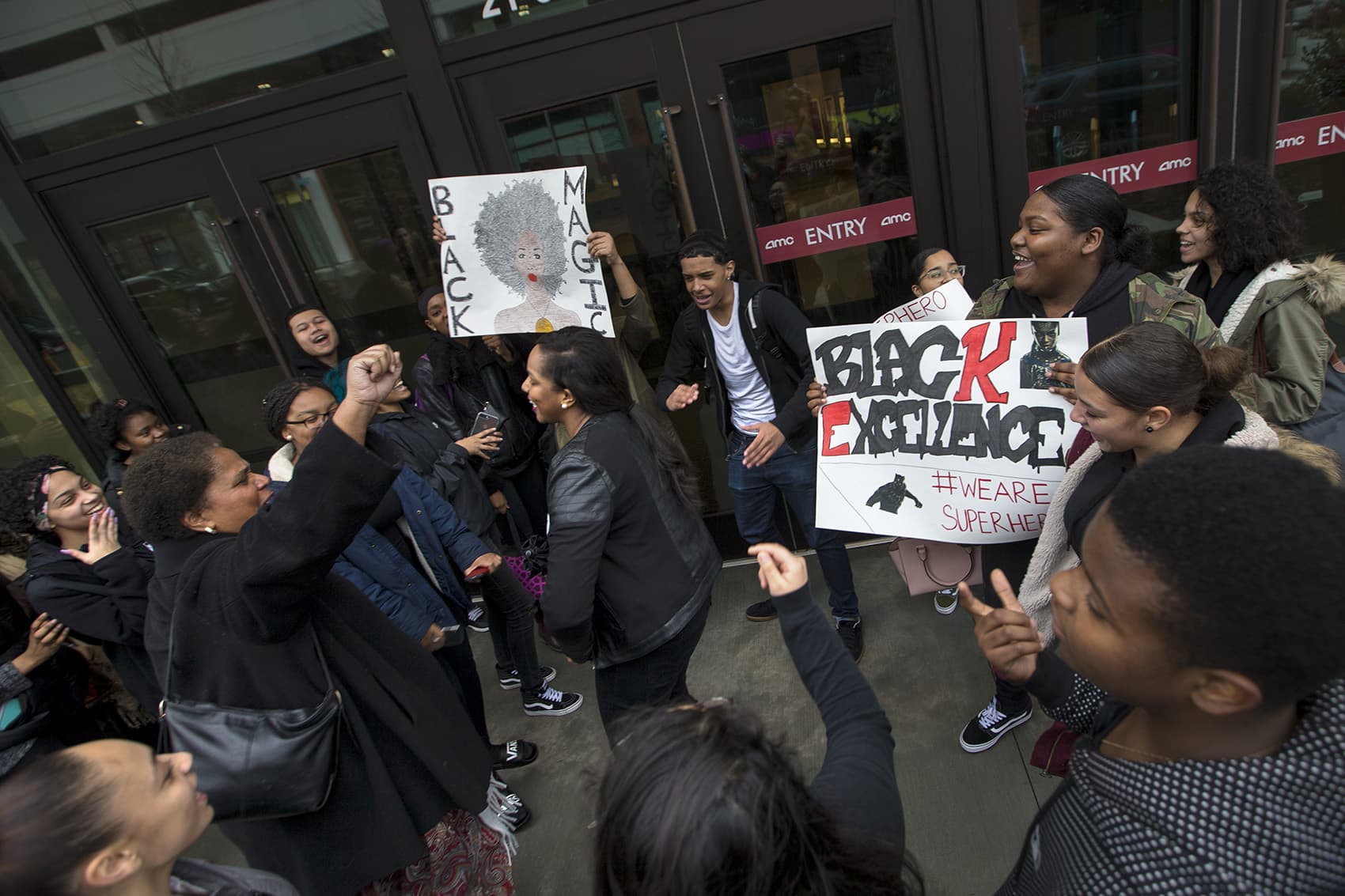 Students from the TechBoston Academy School in Dorchester gather outside the South Bay Center before attending a private screening of "Black Panther." (Jesse Costa/WBUR)