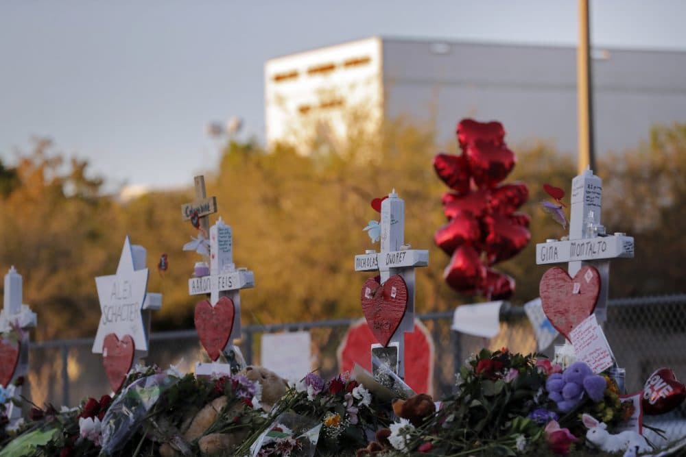 A makeshift memorial is seen outside the Marjory Stoneman Douglas High School, where 17 students and faculty were killed in a mass shooting on Wednesday, in Parkland, Fla., Monday, Feb. 19, 2018. Nikolas Cruz, a former student, was charged with 17 counts of premeditated murder on Thursday. (Gerald Herbert/AP)