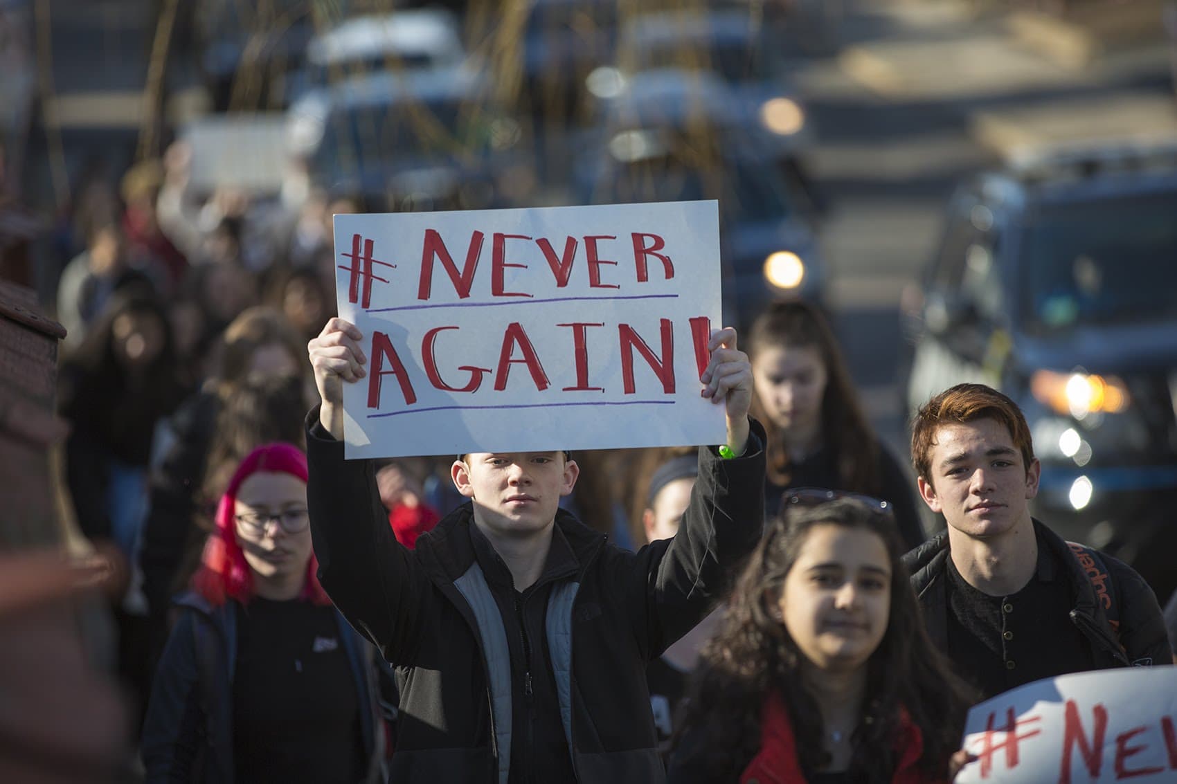 Somerville High School students march down Cedar Street toward Trum Field. (Jesse Costa/WBUR)